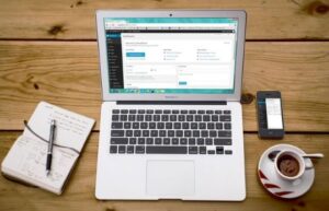 Laptop on desk with coffee