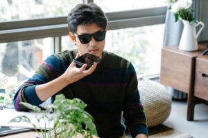 person using SIRI on iPhone