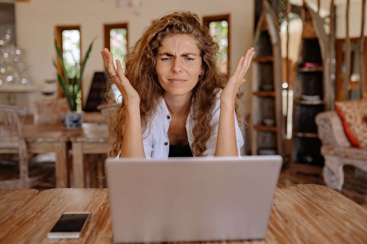 woman frustrated with slow laptop