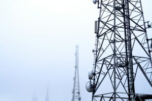 Telecom tower against the sky, representing mobile network infrastructure used to monitor SIM cards in Mali