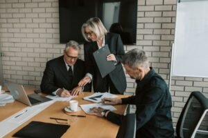 Tech industry executives in discussion, representing the debate over AI development speed