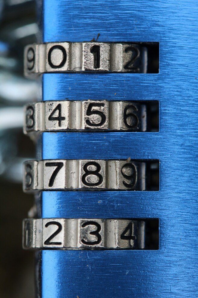 Close-up of a blue combination padlock with number wheels